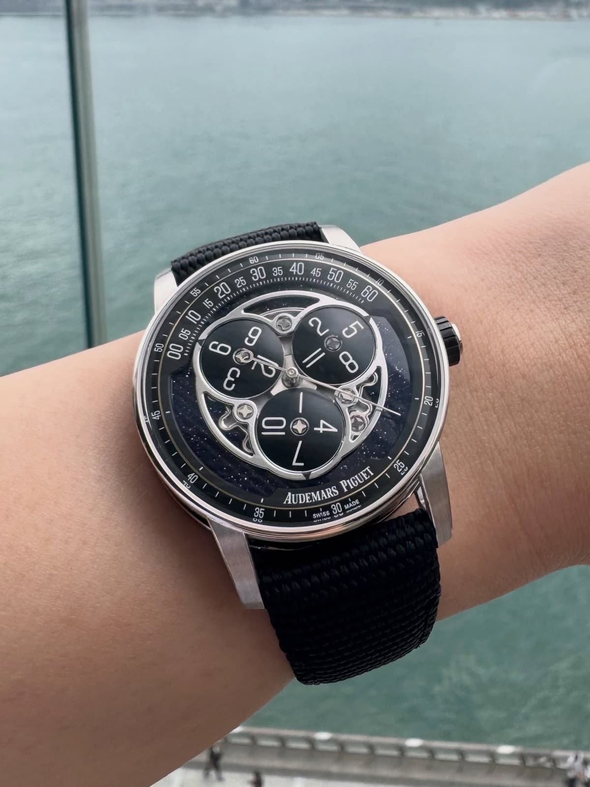 Side view of the Code 11.59 white gold case with its octagonal middle section